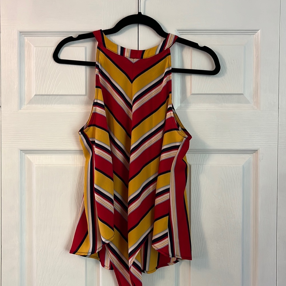 Red, yellow, navy blue tank top with tie bottom and cute button feature on neck.